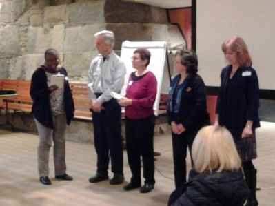 Group presenting their commercial for the self-returning shopping cart